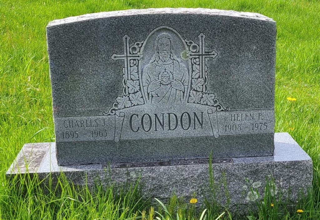 Before image of headstone showing overgrowth and mold